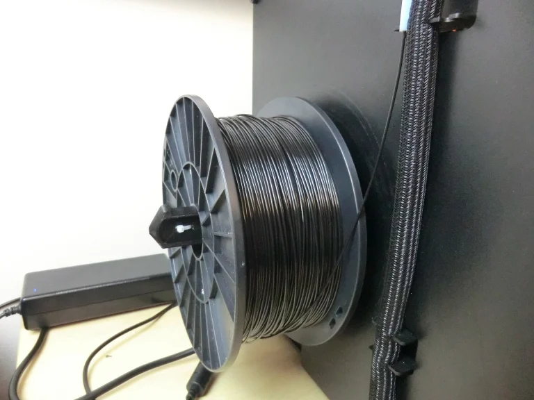 Two filament spools mounted on a 3D printer